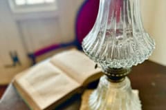 The Gregory House lamp on table.