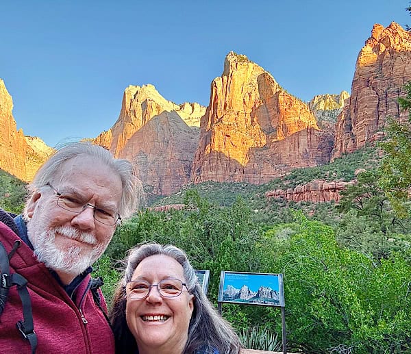 Cindy and Jeff in front of The Court of Patriarchs in Zion National Forest